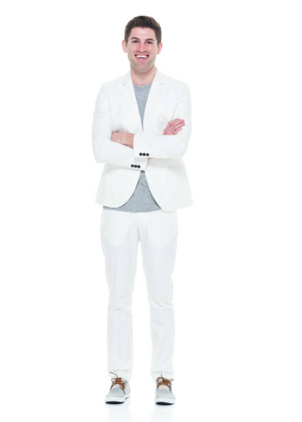 istock Handsome man in white suit with arms crossed 933080996