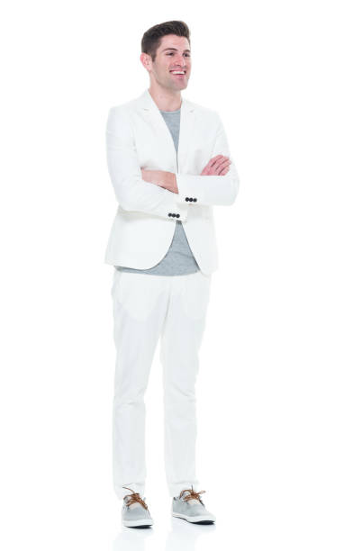 istock Handsome man in white suit with arms crossed 933090836