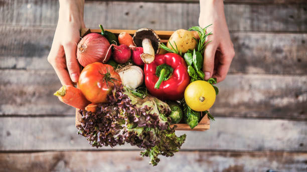 Organic vegetables healthy nutrition concept on wooden background Organic vegetables healthy nutrition concept on wooden background produce basket stock pictures, royalty-free photos & images