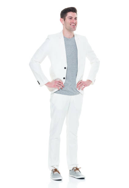 istock Handsome man in white suit with hands on hips 933094682