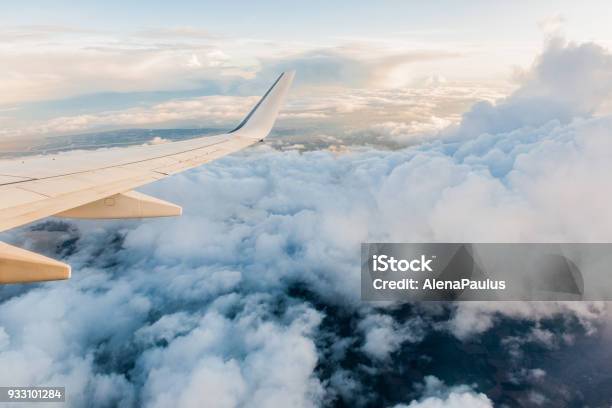 Airplane Wing In Flight From Window Cloudy Sky Stock Photo - Download Image Now - Airplane, Window, Cloud - Sky