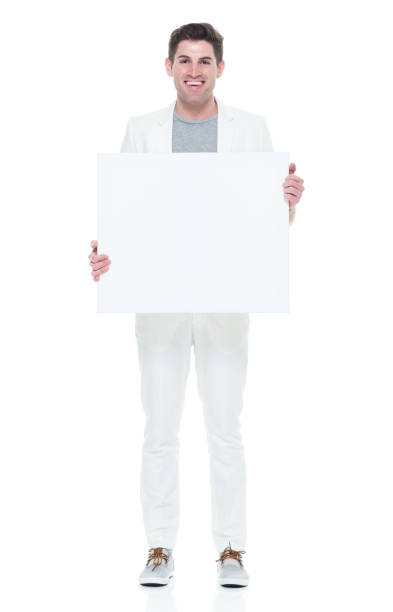 istock Young man that is good looking holding white blank sign 933101962