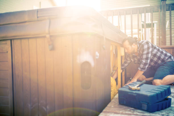 istock Man repairing a hot tub 933101974