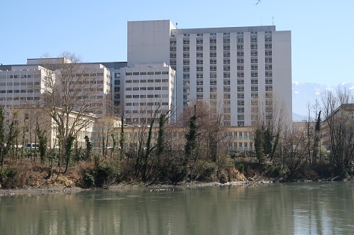 Grenoble, France – March 16, 2017: photography showing Grenoble university hospital. The photography was taken from the street of the city of Grenoble, France.