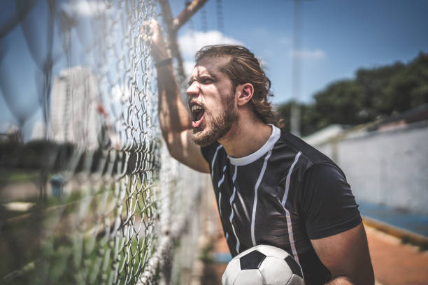 istock Fan watching a soccer game 933105600