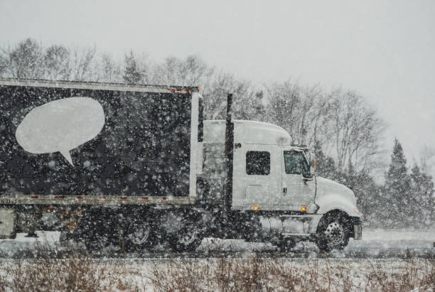 istock Trucking in Winter Storm 933111414