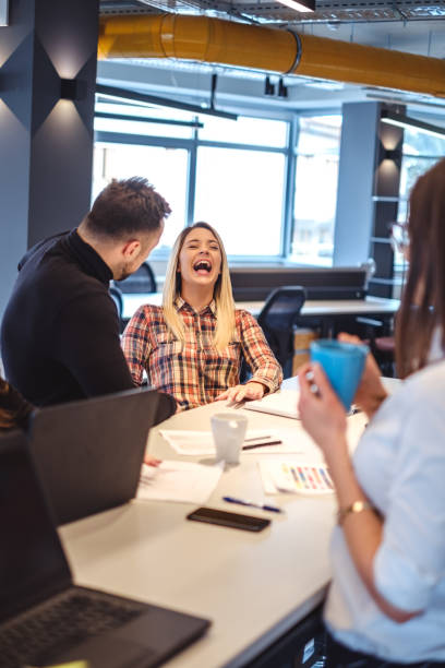 istock Colleagues laughing at the office meeting 933111692