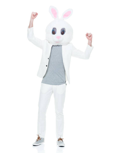 istock Well dressed man with bunny costume cheering 933115710
