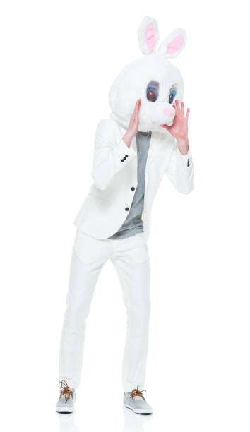 istock Well dressed man with bunny costume shouting 933116172