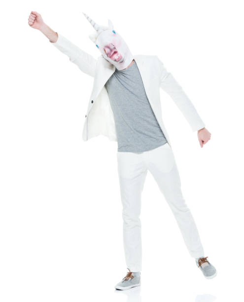 istock Man wearing unicorn mask 933118112