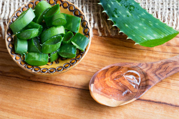 istock Aloe vera pieces, a whole leaf and aloe vera gel on a spoon 933120232