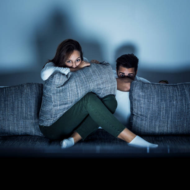 istock Young couple watching a movie 933123418