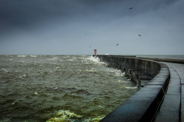 istock a lighthouse on a stormy sea 933123670