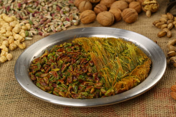 istock Turkish dessert kunefe with pistachio powder - 933123810