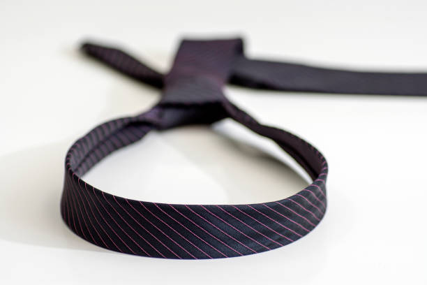 istock black tie knotted in a loop shape on a white background. The concept of not freedom 933123918