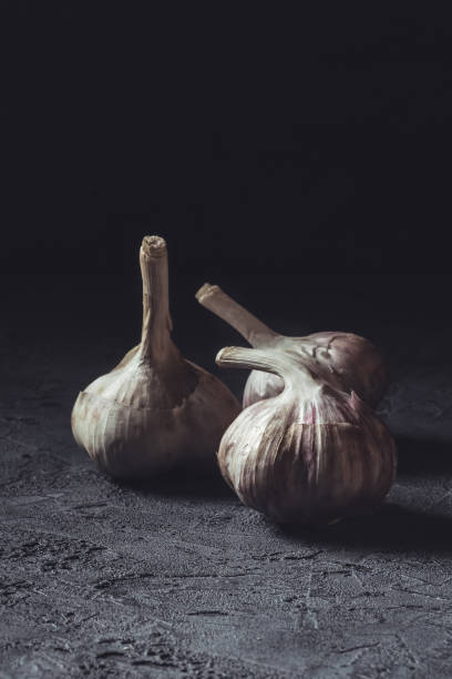 istock Garlic fresh Food Still Life toned low key 933134100