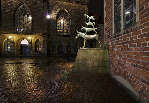 Sculpture of the Town Musicians of Bremen at night stock photo