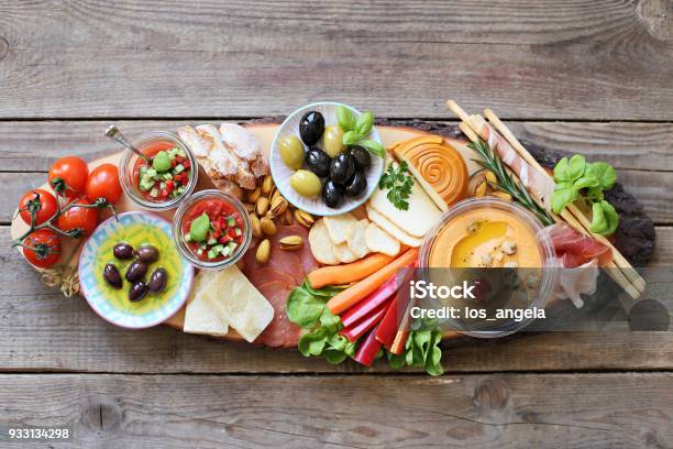 Appetizers Table With Cured Meat Gazpacho Soup Jamon Olives Cheese Hummus And Vegetables Mediterranean Diner Table With Tapas Selection Stock Photo - Download Image Now