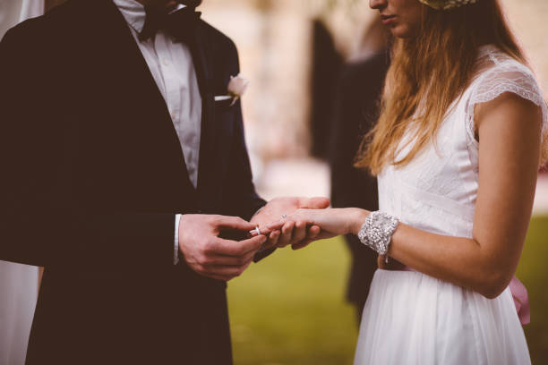 istock Bride and groom exchanging vows and rings during wedding ceremony 933136846