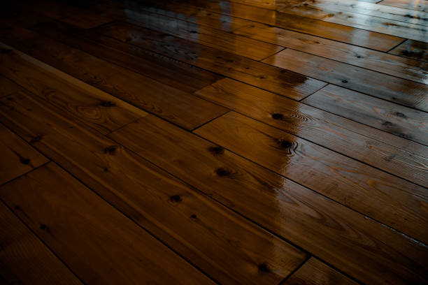 istock Dark varnished wooden floor 933136950