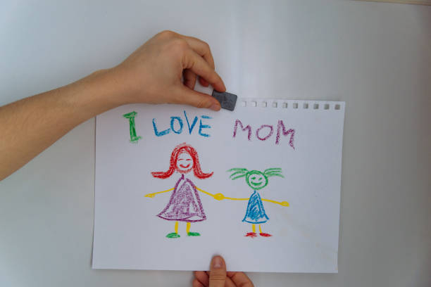 istock children's drawing on fridge. I love mom. 933137292