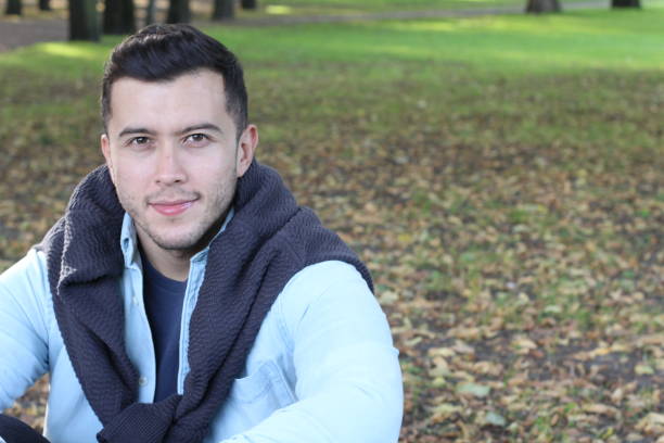 istock Cute boy smiling in the park close up 933141064
