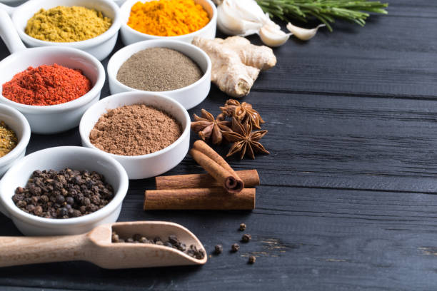 istock Herbs and spices in ceramic bowls. 933144368