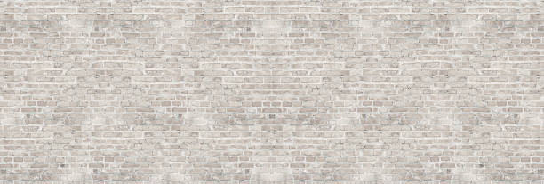 istock Vintage white wash brick wall texture for design. Panoramic background for your text or image. 933144672