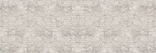 Vintage white wash brick wall texture for design. Panoramic background for your text or image.