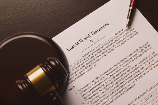 istock Notary's public pen and stamp on testament and last will. 933148166