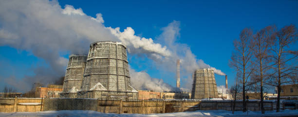 istock Panorama of a cement plant with smoking pipes 933150848