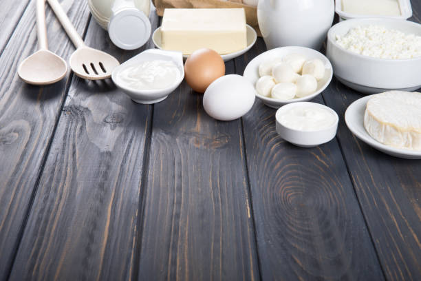 istock Dairy products on wooden table. 933154386