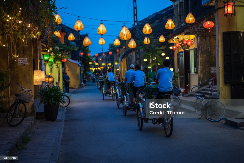 Night view of busy street in Hoi An, Vietnam. Night view of busy street in Hoi An, Vietnam. Hoi An is the World's Cultural heritage site, famous for mixed cultures and architecture. Vietnam Stock Photo