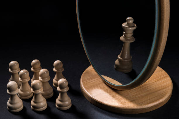 istock The chess pieces in front of the mirror. 933163978