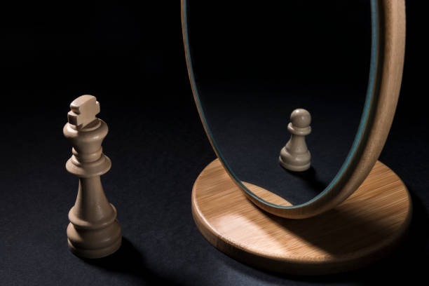 istock The chess pieces in front of the mirror. 933166444