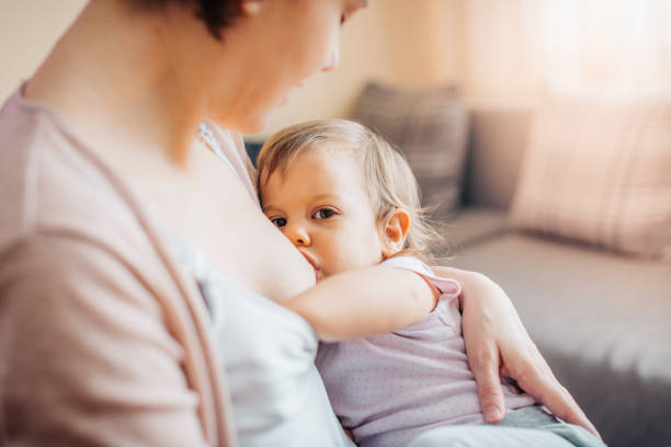 istock Mother breastfeeding nursing toddler looking at each other 933169100