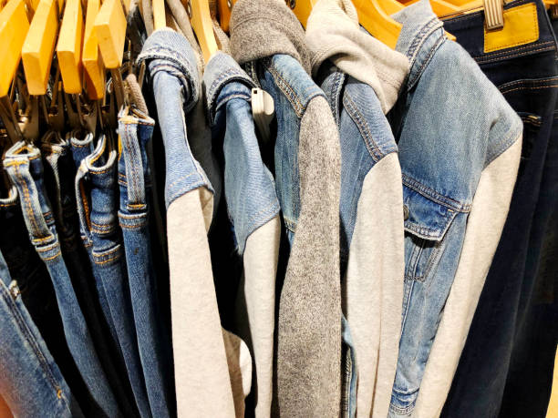 istock Modern clothes in a shop on a hanger. 933172744