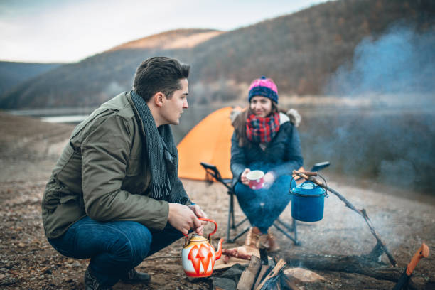 istock Campers next to the campfire preparing food 933175248