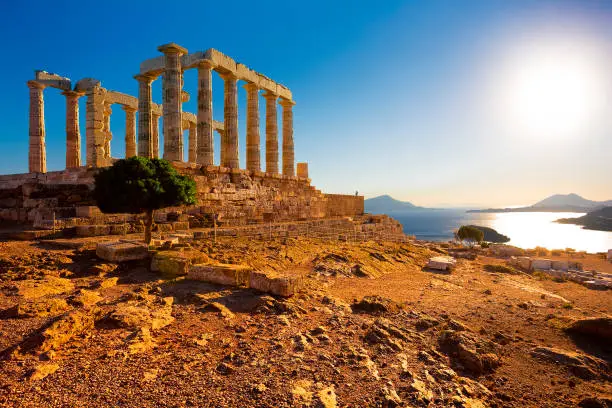 Greece. Cape Sounion - Ruins of an ancient Greek temple of Poseidon before sunset