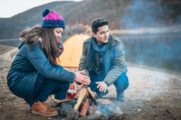 istock Campers next to the campfire preparing food 933175364
