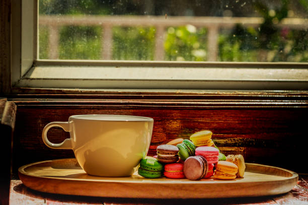 istock French macaroon cake in wood cup. 933179080