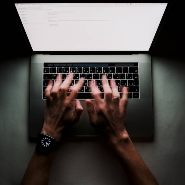 istock Man is working typing use laptop computer at dark night. Writer flat lay top view workplace 933184148