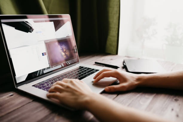 istock Man freelancer is working using laptop computer at home office. Freelance lifestyle workplace 933184206