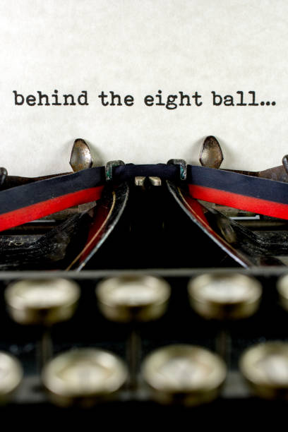 istock Antique typewriter with saying behind the eight ball 933214788