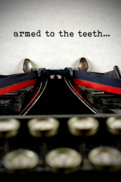 istock Antique typewriter with saying armed to the teeth 933214946