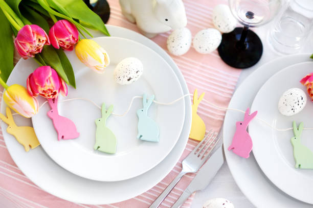 istock Beautiful table setting with crockery and flowers for Easter celebration 933219838