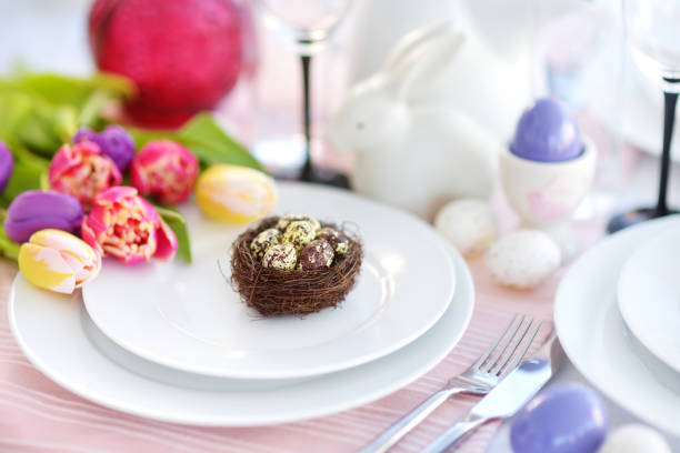 istock Beautiful table setting with crockery and flowers for Easter celebration 933219870