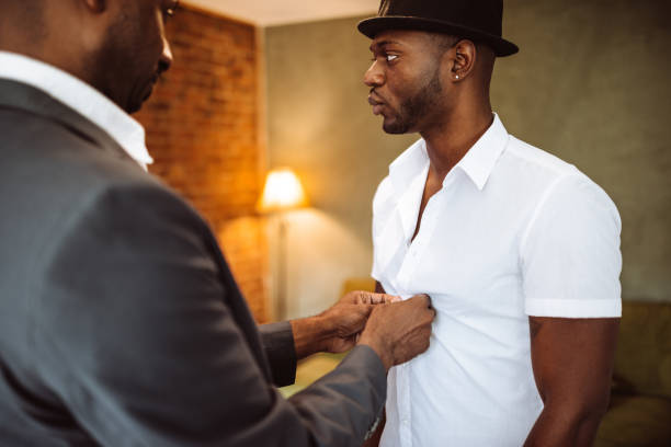 istock gay couple preparing to night out 933239292