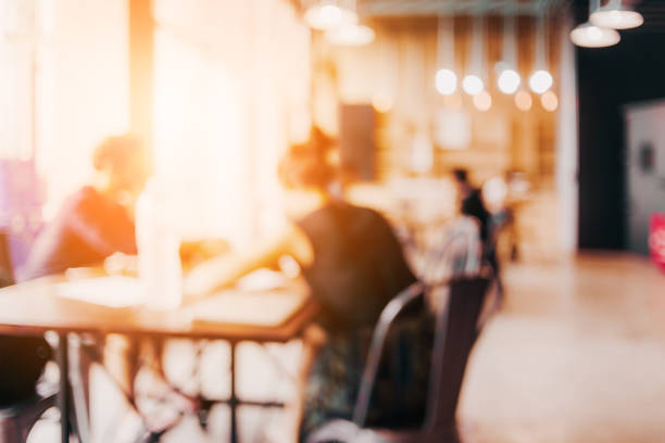 istock blur image background of office or co working space with people 933268928