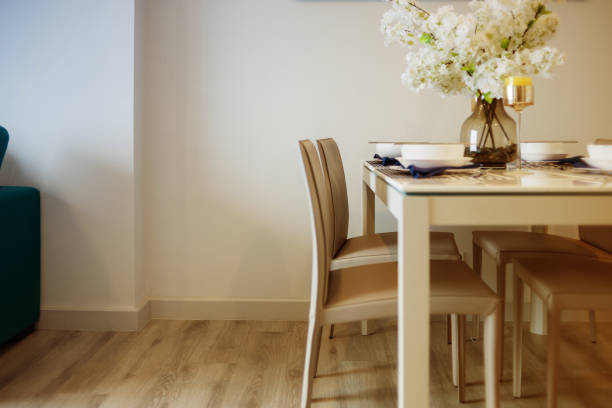 istock dining room with wood floor and white wall background 933270270